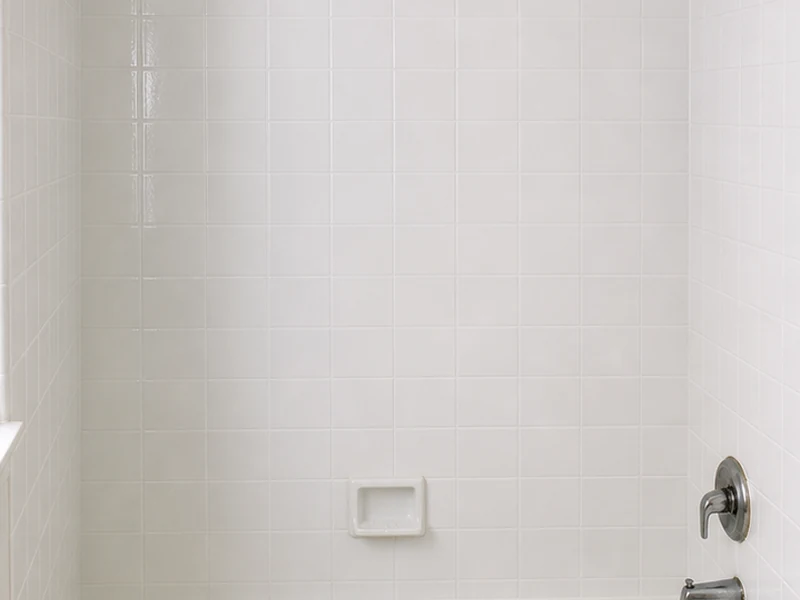 Same tile tub surround reglazed to a uniform white in a Southgate bathroom, Hayward